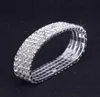 12 stycken Lot 4 Row Crystal Diamante Rhinestone Elastic Bridal Bangle Armband Stretch hela bröllopstillbehör för kvinnor2729073