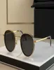 Créateur de mode 1033 Lunettes de soleil pour hommes classiques Vintage Metal Round Sun Glasses Summer Temperament Simple Temps Top Quality Anti1052407