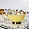 Tazze piattiere hf in porcellana in porcellana di alta qualità farfalla a farfalla tacca da tè piatto set di tè pomeridiano britannico tè ceramico tazza da ufficio bevande da ufficio