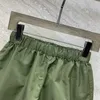 Kvinnors shorts designer 24 tidigt vår ny mode triangel bokstav avslappnad byxor klassisk elastisk midja nylon vik mångsidig bm8n