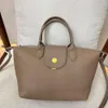 2023 Neue vielseitige Handtasche einzelner Schulterkreuzkörper Einfacher Textur Womens Bag