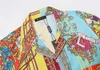 Summer Maglietta maschile designer stampato bottoni cardigan seta a maniche corte top top di alta qualità da camicia da camicia da camicia da camicia da camicia da spiaggia europea M-3xl EM53