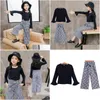 Clothing Sets Girl Clothes Set Children Flared Long Sleeve Solid Black T-Shirt Plaid Wide Leg Pants Suits 2Pcs Outfits Kids Drop Deliv Otnp3