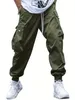 Multiple Pockets Men Loose Work Pants Vintage Solid Patched Flap Pocket Drawstring Waist Cargo Casual Street Jogger Pants for Outdoor Wear Please Purchase A Size Up