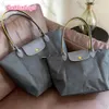 2024 Designer Bag Womens Tote Shoulder European Style Leisure Dumpling Bag Nylon Handbag Crossbody Folding Embroidery Tote Shopping Mini 9025ess 10a1s