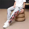 Pantaloni da uomo primavera estate uomini sfoggiano pantaloni casual all'aperto patchwork stampato leggero maschio cantaccante