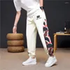 Pantaloni da uomo primavera estate uomini sfoggiano pantaloni casual all'aperto patchwork stampato leggero maschio cantaccante