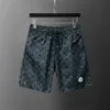 New Mens Shorts Verão Verão Black Printing Designer Board Shorts Moda Casual Sports Loose Secywear Men calças de praia M-3xl7