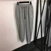 Kvinnors tvådelar Pants Designer Ny broderad halv blixtlås Långärmad hooded hoodie+dragstring elastisk midja slips fötter casual rb0z