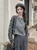 女性用ニットチェッカーシャツパッチワークニットセーターは、ニッチなゆるい半袖の春と秋のデザイン感覚を持つセーター