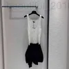 Basic & Casual Dresses designer A must-have item for this season, black and white color block, drum dot hollowed out knitted vest skirt, embellishment at the neckline 4IF4