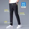 Pantalon masculin printemps et sumber la version coréenne de glace décontractée plus tendance de mode taille en gros de la jambe droite