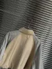 Suits-survêtements féminins 2024 Costume de mode plissé de veste d'épissage cordon un short pendule 2 pièces 0319