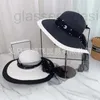 Breda randen hattar hink designer gaze pärla överdimensionerad grim svartvitt färg lapptäcke stråhatt för barn elegant koreansk version gåva hav fritid semester