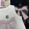 Chars pour femmes concepteur de camis Xiaoxiang industrie lourde papillon rose papillon chaud en diamant tissu rond du cou rond