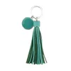 Nyckelringar zwpon mode runda monogram pompom pu läder tassel nyckelring väska charms nyckelring färgglada emalj kvinnlig smycken grossist 240412