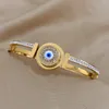 Bracelet des yeux bleus rotatifs en acier inoxydable avec accessoires de strass de luxe pour femmes coiffures bijoux imperméables
