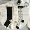 Femmes chaussettes thermiques noires blanches longues étages floraux lolita filles kawaii knoue mignon jk coton de style japonais