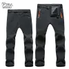 Spodnie trvlhego Winter Outdood Winterproof Snowboard Skiing Pants Mężczyźni Mężczyzny na łyżwach śnieżnych wędrówki Wodoodporne wodoodporne, utrzymuj ciepło oddychające