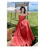 Casual jurken vrouwen rode vakanties uitgehold backless geplooide jurk zomer uit schouder mouwloze strapless ruches feest a-line lang