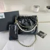 Diseñadores de bolsos vendedores calientes bolso popular versátil nueva cadena de cuadrícula Crossbody cubo