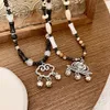 Yeni Çin tarzı boncuklu çok yönlü kelebek üst düzey tasarım kazak zinciri yaz köprücük kemiği mücevher kolye kadınlar için