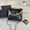 Diseñadores de bolsos vendedores calientes bolso popular versátil nueva cadena de cuadrícula Crossbody cubo