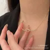 Amour en forme de cœur en forme de coeur alcaline Chaîne de clavicule nouée de nœuds simples et polyvalents à la mode pour femmes accessoires de collier haut de gamme