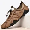 Lässige Schuhe Leder Männer Sneakers atmungsaktive Slip-on-Herren-Ladungsstoffe Moccasins Handgefertigtes Fahren Plus Size 48