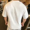 T-shirt uomini a manica corta traspiranti che corrono maglietta in fitness sciolta