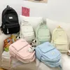 バックパック女性カワイイピンクティーンエイジャーナイロンラップトップブックバッグガールメンズトレンディカレッジファッション女性旅行学校の学生クール