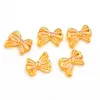 Fleurs décoratives 50 / 100pcs Diy 3d Ab Placing Bow Tie Nail Bowtie Design Acrylique Art Résine Décoration