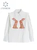 Mulheres Vintage Rabbit Camisa impressa de rua de greamwear de greaminha doce Moda chique em grandes dimensões fêmeas soltas All-Match Bloups Tops 240408