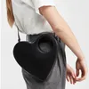 Sac Luxury Sacs en cuir PU en forme de coeur simple pour les femmes Personnalité sac à main