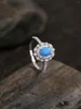 Anelli di cluster di alta qualità sterling da 925 silver con opale blu e zirconi brillanti versatili retrò squisite da donna