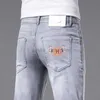 Lyxdesigner jeans för mens vår/sommar ny produkt jeans, mäns smala passform, små fötter, high end trendiga märke elastiska tunna tryckta byxor mode byxor bb987gv