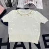 Designer de t-shirts pour femmes Xiaoxiangfeng 24 Été Nouvelle industrie lourde à cou rond chaîne tricotée diamant plein arc Pullover à manches courtes