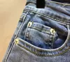 Kvinnors jeans europeiska station 2024 vår sommar kvinnor denim byxor lapptäcke mesh broderi sträcka hög midja ankellängd blå