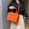 Handbag Designer 50% Discount on Hot Brand Women's Bags Fashion Trendy Letter Indentation Handheld Womens Bag Versatile Large Capacity Commuting Tote