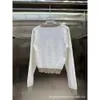 女性のニットTシャツ初秋ニッチデザイントレンディVネックスタイリッシュなスタイルボタン装飾スリムニットトップ