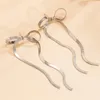 Boucles d'oreilles étalon élégante couleur or long cache-bowknot de filet pour femmes simples conception de la chaîne de serpents jeunes filles bijoux de bijoux n751