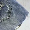 Kvinnors shorts tidigt på våren kvinnors shorts modebrev broderi nödställda tvättade denim shorts designer byxor kvinnor blå a-line heta byxor c240413