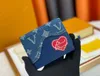 2024 Nuovo clip di stile in pelle denim patchwork design wallet borse borse borse borse borsette borse da sera con la cartella m81020 M81020