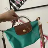 Mini lyx crossbody designers plånbok handväska clearance detaljhandelsgrön handväska äkta läder grossist femme väska klimpa designer små handväskor smink väskor