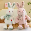 Novo Bixin Bixin Rabbit Doll Plush Toy Bow Posição de sentar na posição de coelho