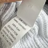 Kvinnors stickor 2024 Vår- och sommar V-ringning Kontrasterande linjer Sökade linne Sticked Cardigan Half ärmade kvinnors toppar