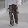 Pantalon féminin pantalon élastique de taille moyenne pantalon léopard à imprimer le jambe large pour les femmes élégantes streetwear long