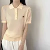 女性のニットティーデザイナーブランド24年の新しい夏の服、シンプルなホローアウトデザイン、エレガントでカジュアルなポロカラー短袖ニットシャツトップQ57n