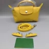 デザイナーの卸売ボルサオリジナル穴あき黄色のバッグカラートイレタリーバッグストラップパンミニ軽dumplingスモール選択肩の財布の女性トート