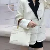 Bolso de diseño de lujo Nuevo bolso simple y de moda Mujeres Patrón de vaca de alta calidad Hombres Damas Tota de bolsas Paquete de bolsas